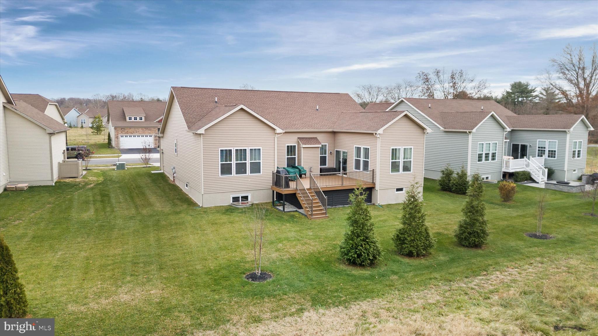 5338 Newman Lane Middletown, DE 19709 - Photo 51 of 61 a view of a house with a big yard and potted plants
