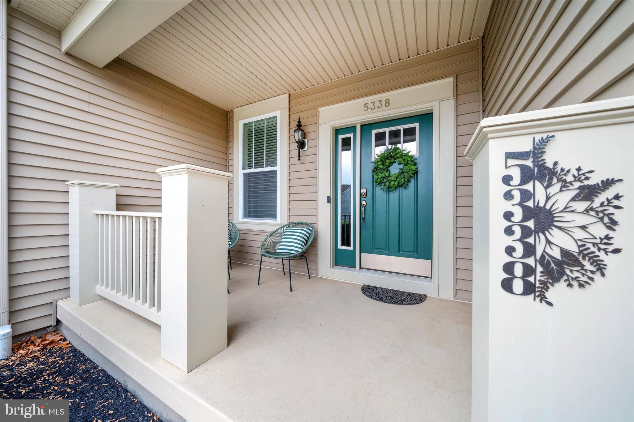 5338 Newman Lane Middletown, DE 19709 - Photo 10 of 61 a view of a porch with furniture and floor to ceiling window
