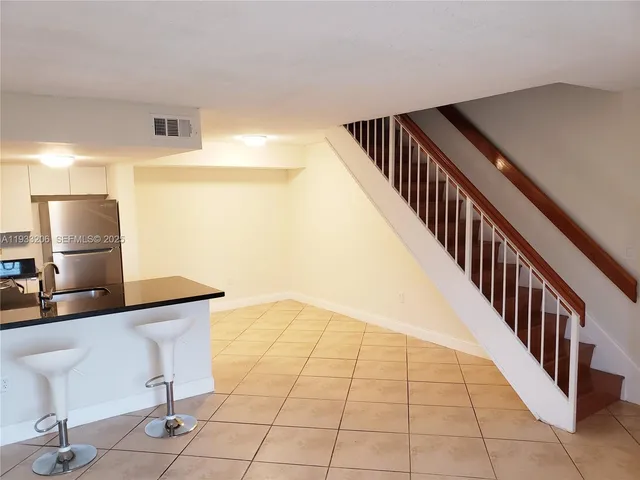 a view of a hallway with seating area