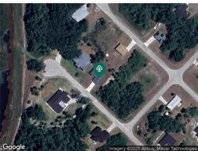 an aerial view of residential house with outdoor space