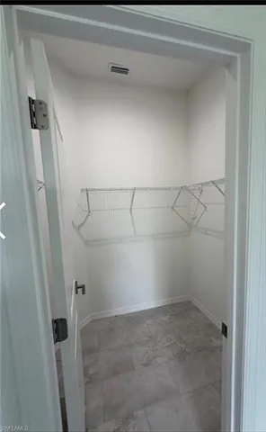 a view of a room with racks on the wall