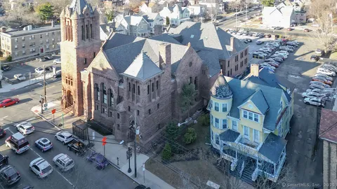 a view of multiple houses with outdoor space