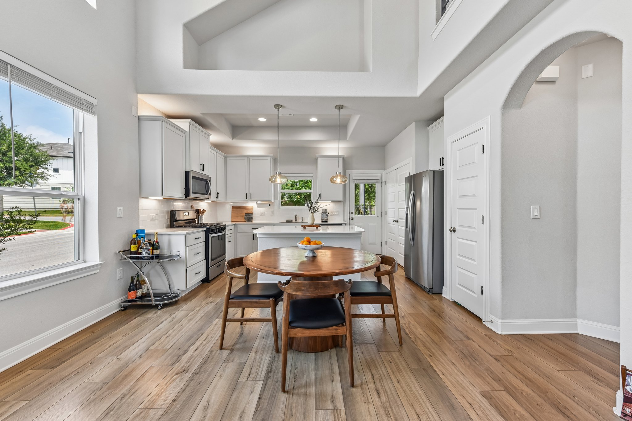 9901 Thane Way, Unit 91 Austin, TX 78748 - Photo 11 of 24 Dining area and room for bar stools at the kitchen island allow for plenty of space for everyday living and entertaining