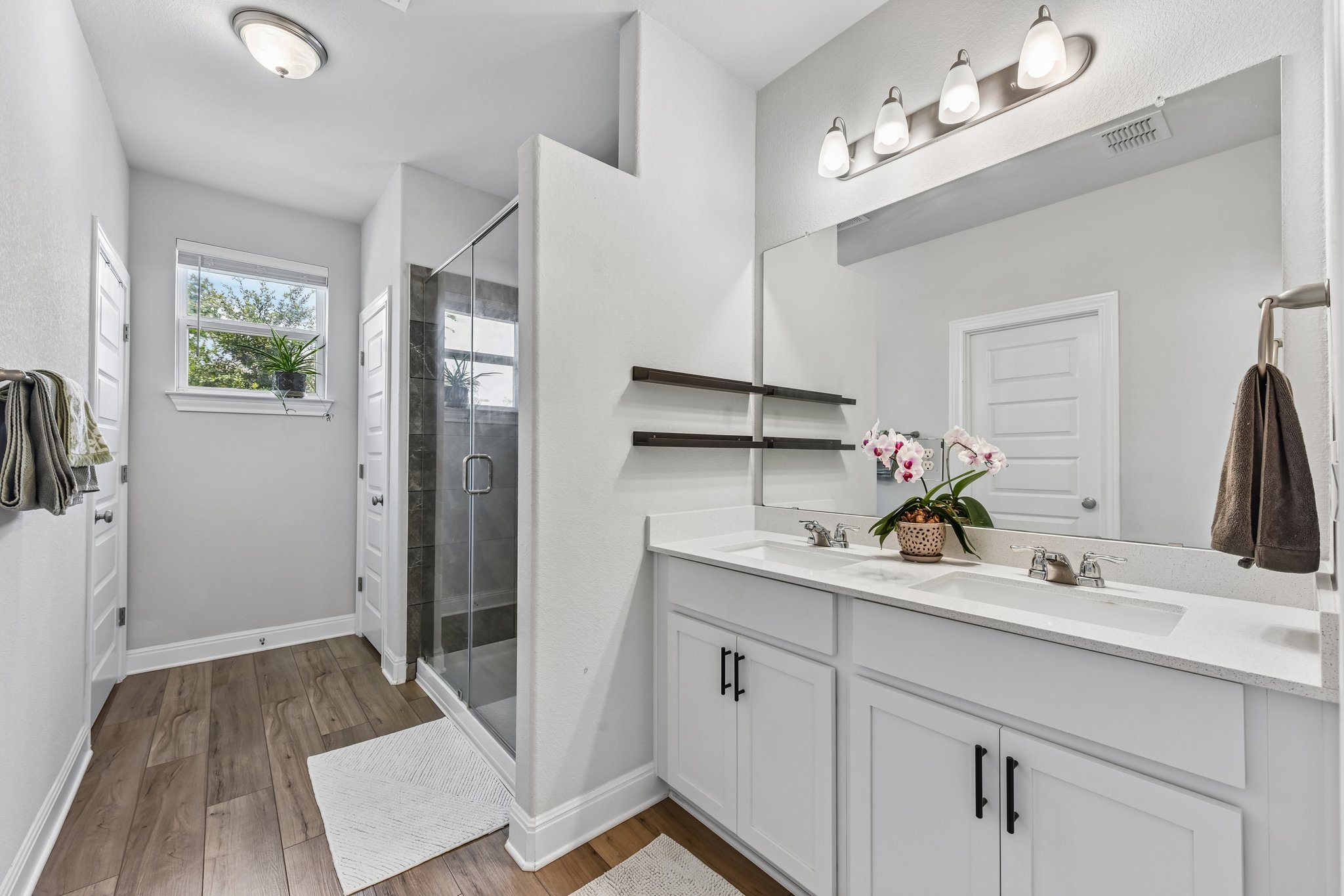 9901 Thane Way, Unit 91 Austin, TX 78748 - Photo 13 of 24 Primary Bathroom features an expansive walk in shower and dual vanities
