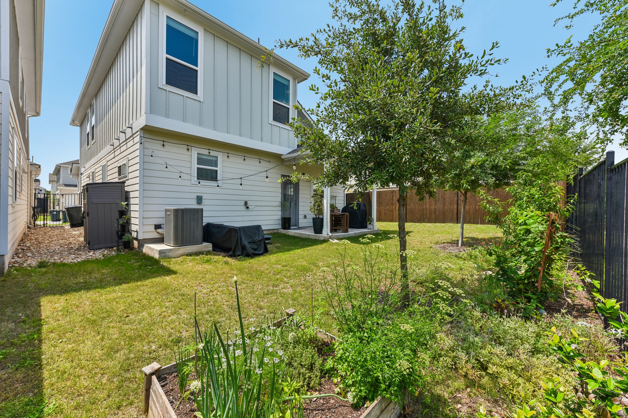 9901 Thane Way, Unit 91 Austin, TX 78748 - Photo 23 of 24 Enjoy your lush landscaping and raised garden bed. Hang on your covered patio and enjoy this gorgeous yard