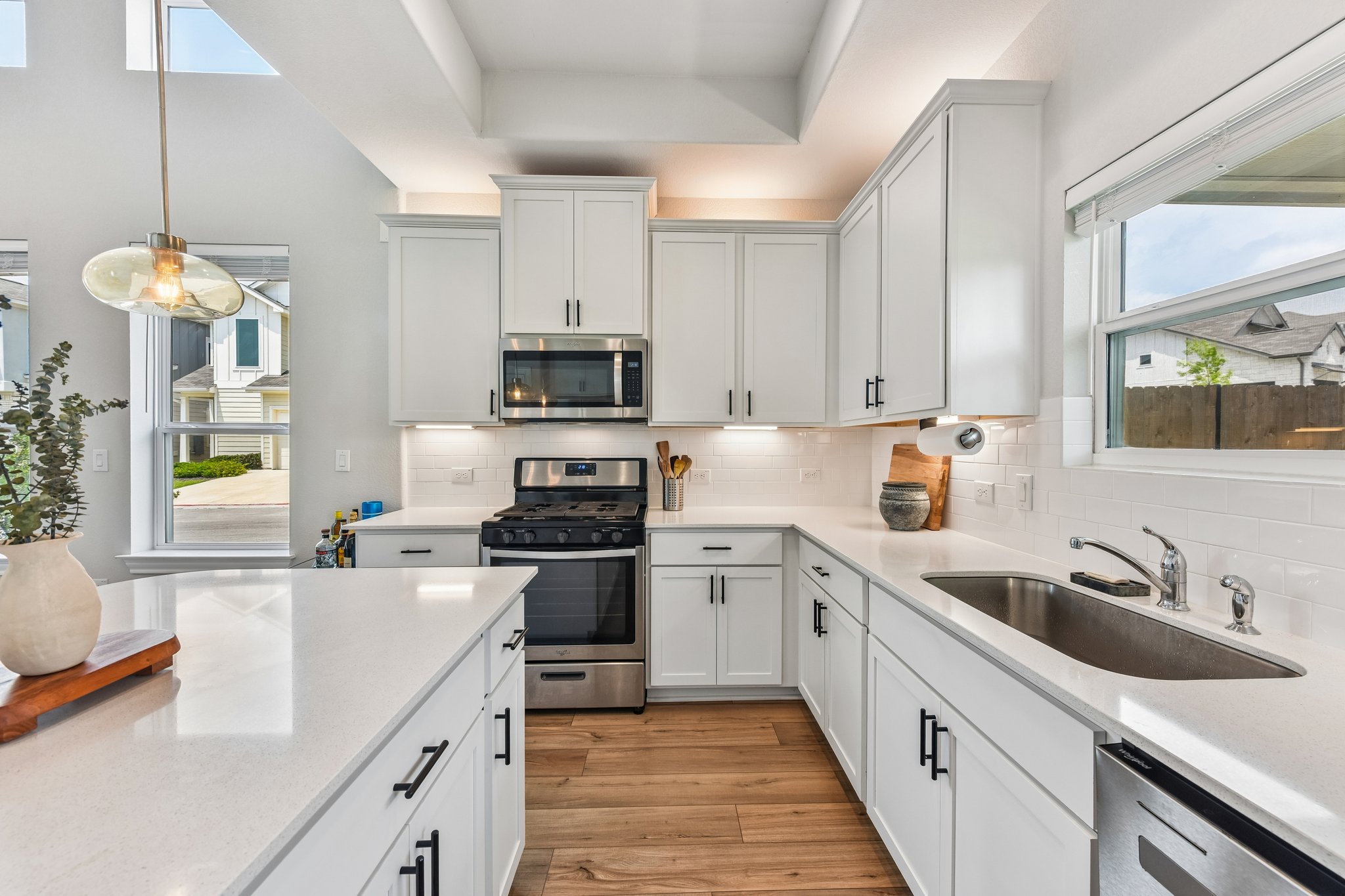 9901 Thane Way, Unit 91 Austin, TX 78748 - Photo 8 of 24 Kitchen features 42" Cabinetry, quartz countertops, and stainless steel appliances