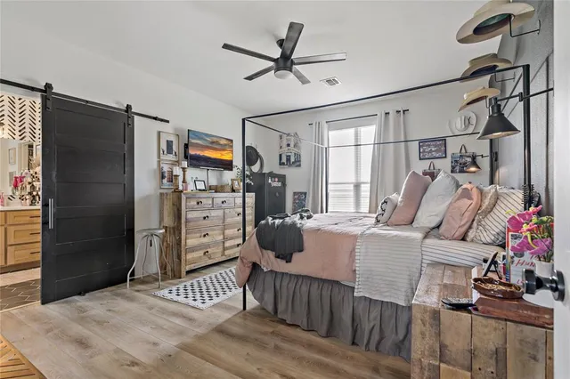 a bed room with a bed and a window