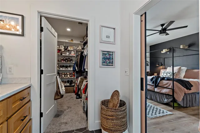 a kitchen with stainless steel appliances kitchen island granite countertop a stove and a refrigerator