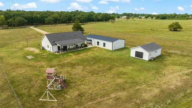 a aerial view of a house with a lake view