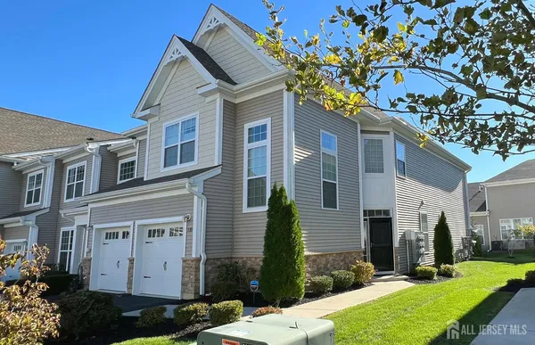 a front view of a house with a yard