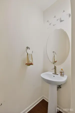 a bathroom with a sink and mirror