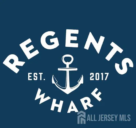 a view of a white house with a large windows yard and a large tree