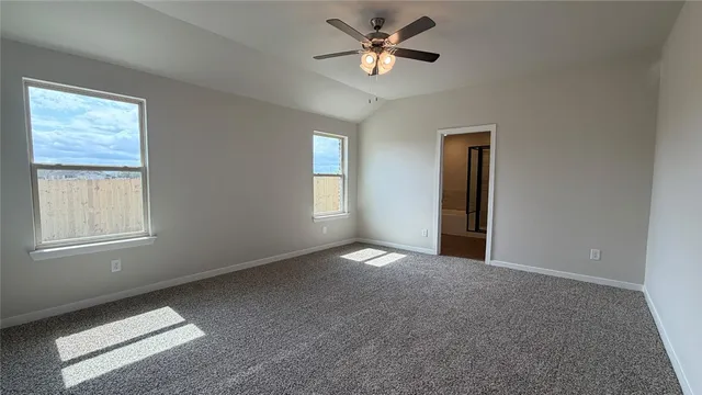 a view of empty room with windows