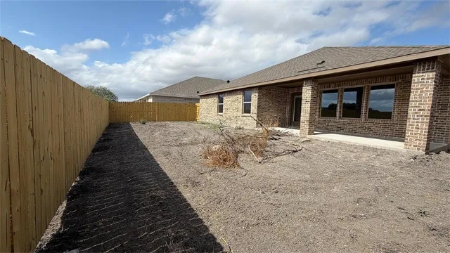 a front view of a house with yard