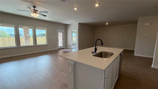 a kitchen with sink and window