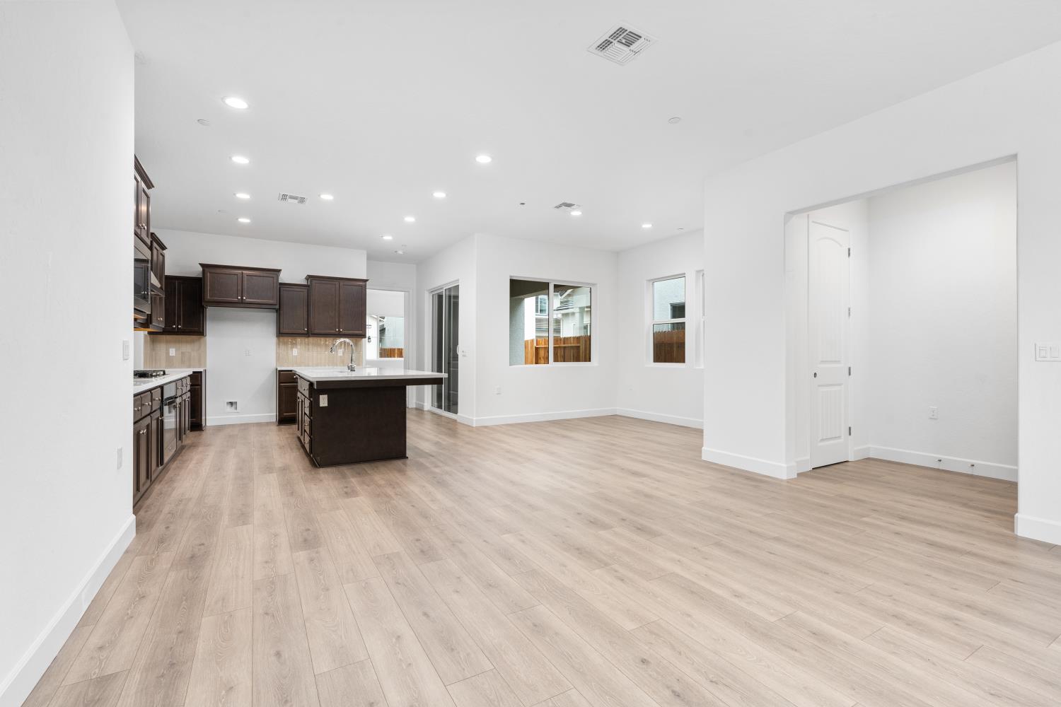 395 Peters Lane South Madera, CA 93636 - Photo 2 of 13 a view of kitchen with microwave cabinets and wooden floor