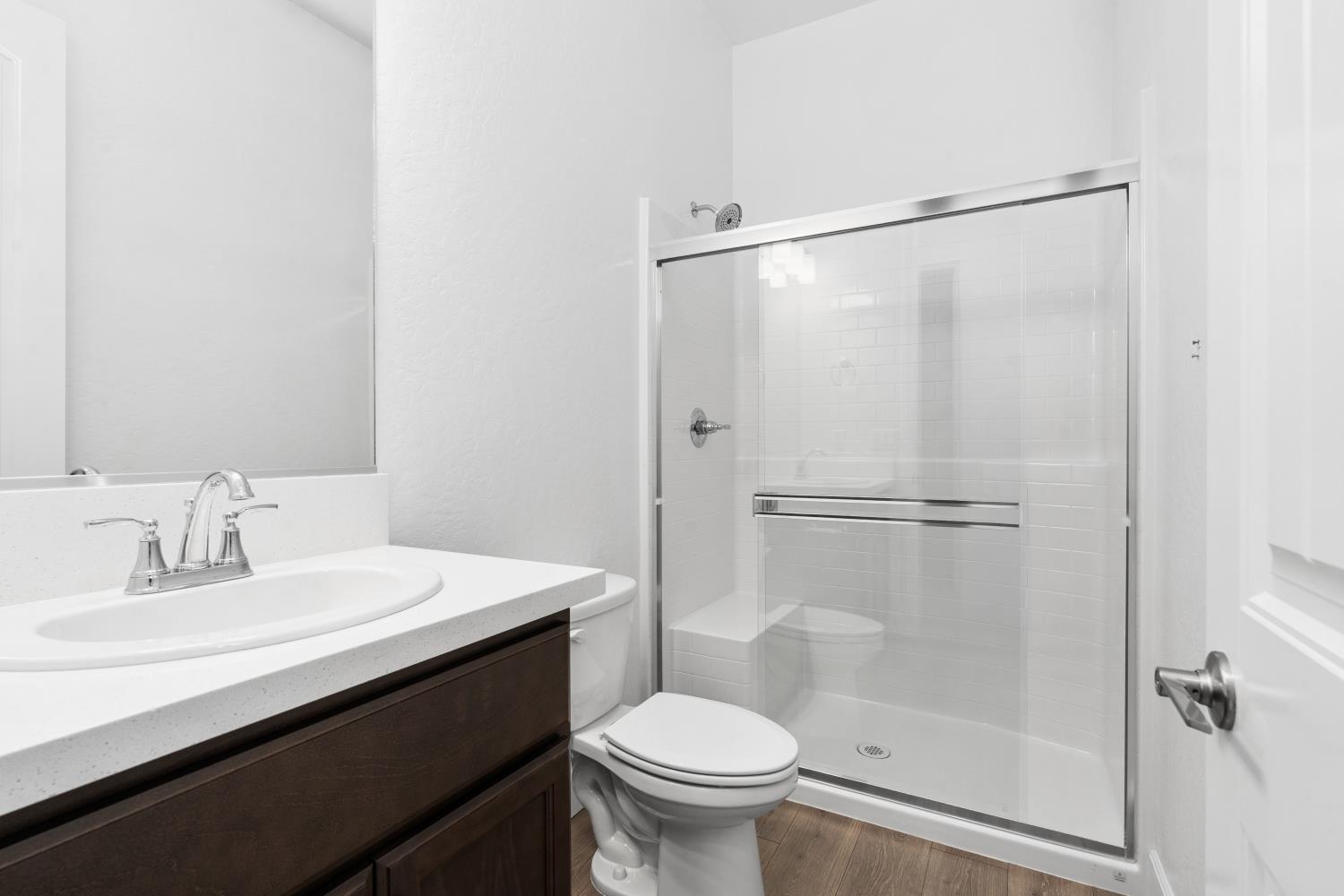 395 Peters Lane South Madera, CA 93636 - Photo 6 of 13 a bathroom with a sink toilet and shower