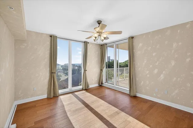 a view of an entryway with wooden floor