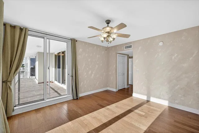 a bathroom with a sink vanity granite and toilet