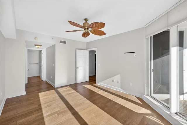 a bathroom with a sink vanity mirror and toilet