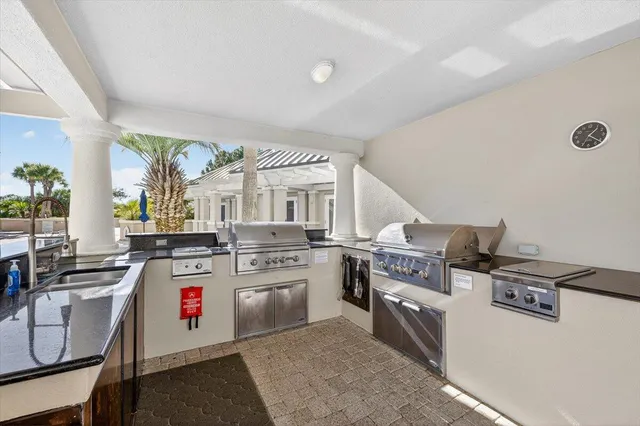 a kitchen with a stove and a white cabinets
