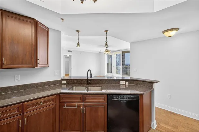 a kitchen with a refrigerator microwave and sink