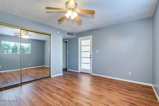 a view of livingroom with window and wooden floor