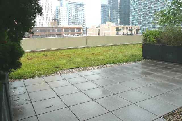 a view of a terrace with yard