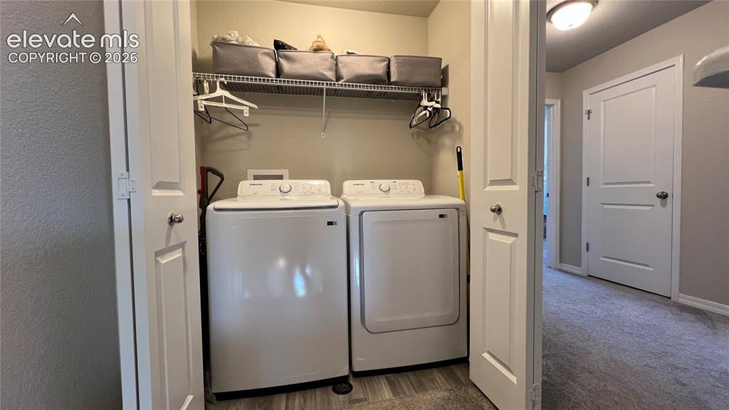 2940 Magic Carpet Loop Colorado Springs, CO 80916 - Photo 20 of 21 a utility room with dryer and washer