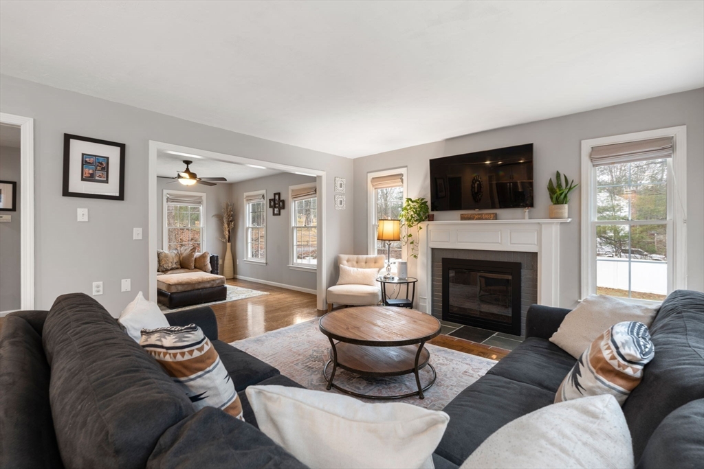 45 Auburn Road Millis, MA 02054 - Photo 11 of 31 a living room with furniture a flat screen tv and a fireplace