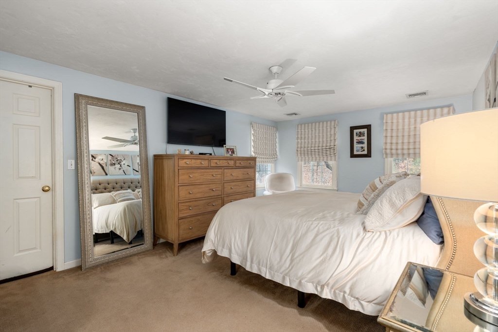 45 Auburn Road Millis, MA 02054 - Photo 18 of 31 a bedroom with a bed and a flat screen tv