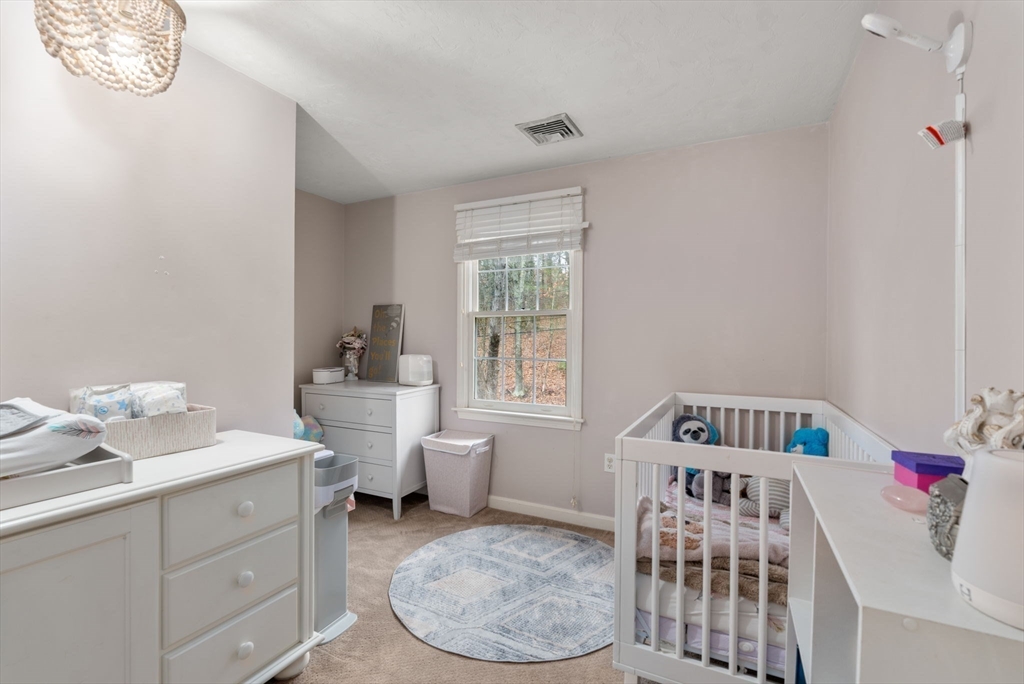 45 Auburn Road Millis, MA 02054 - Photo 20 of 31 a bedroom with a bed and a window