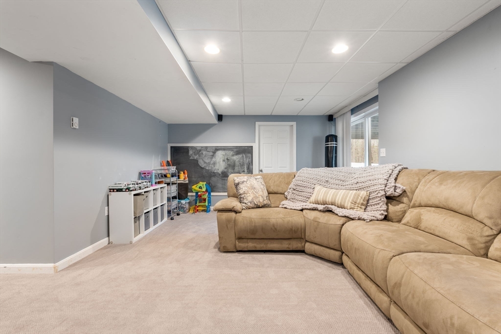 45 Auburn Road Millis, MA 02054 - Photo 24 of 31 a living room with furniture and a table