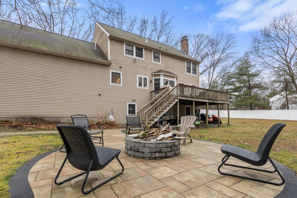 45 Auburn Road Millis, MA 02054 - Photo 30 of 31 a backyard of a house with table and chairs
