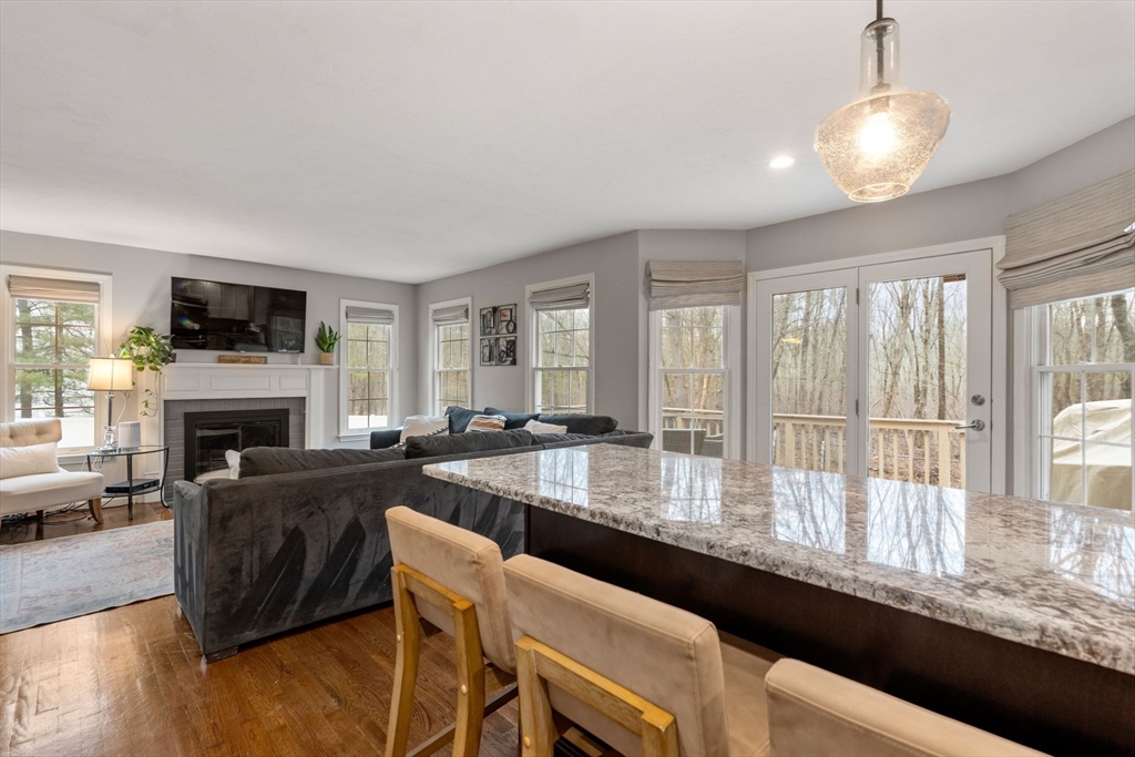45 Auburn Road Millis, MA 02054 - Photo 8 of 31 a living room with fireplace furniture and a large window
