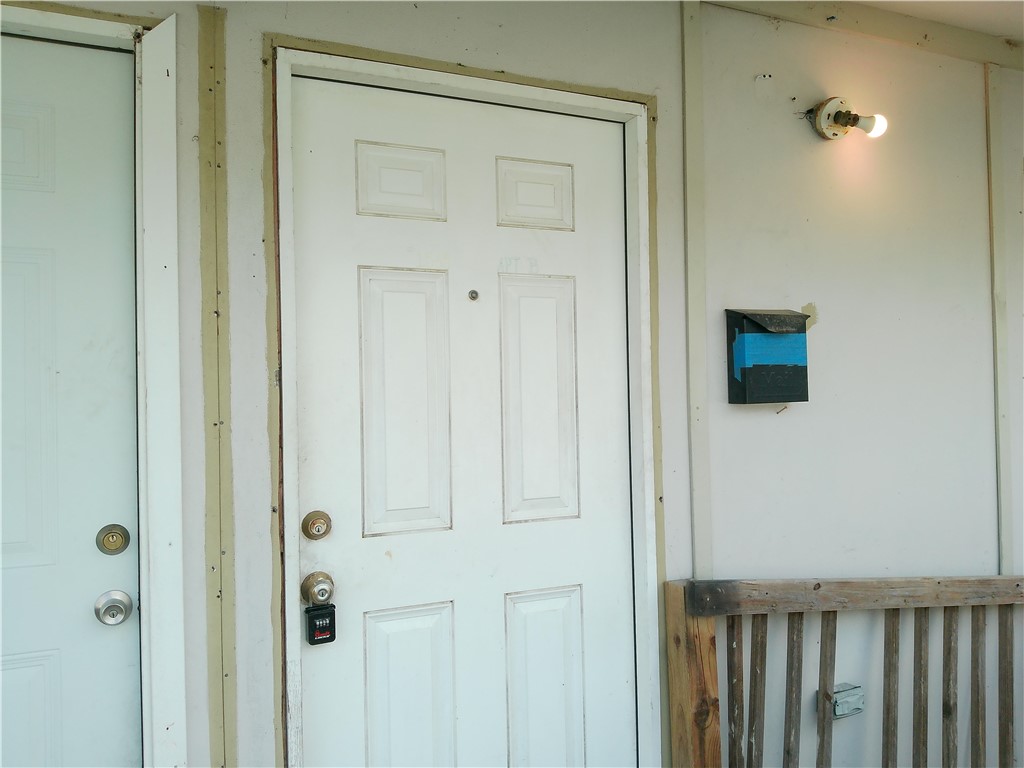 1563 18th Street, Unit B Corpus Christi, TX 78404 - Photo 2 of 7 a view of a hallway with wooden floor