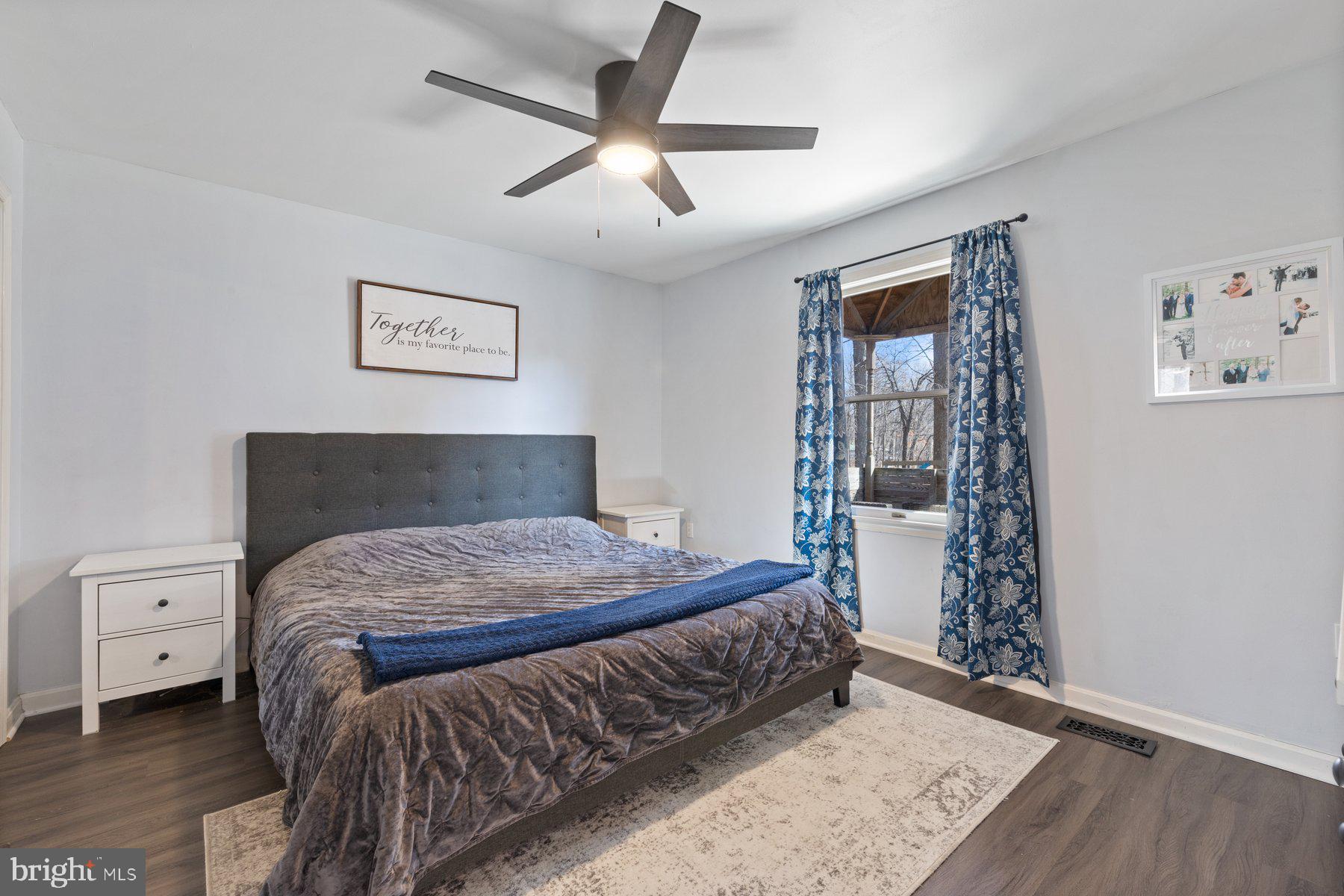 4181 Buffalo Road Mount Airy, MD 21771 - Photo 14 of 38 a bedroom with a bed and a window