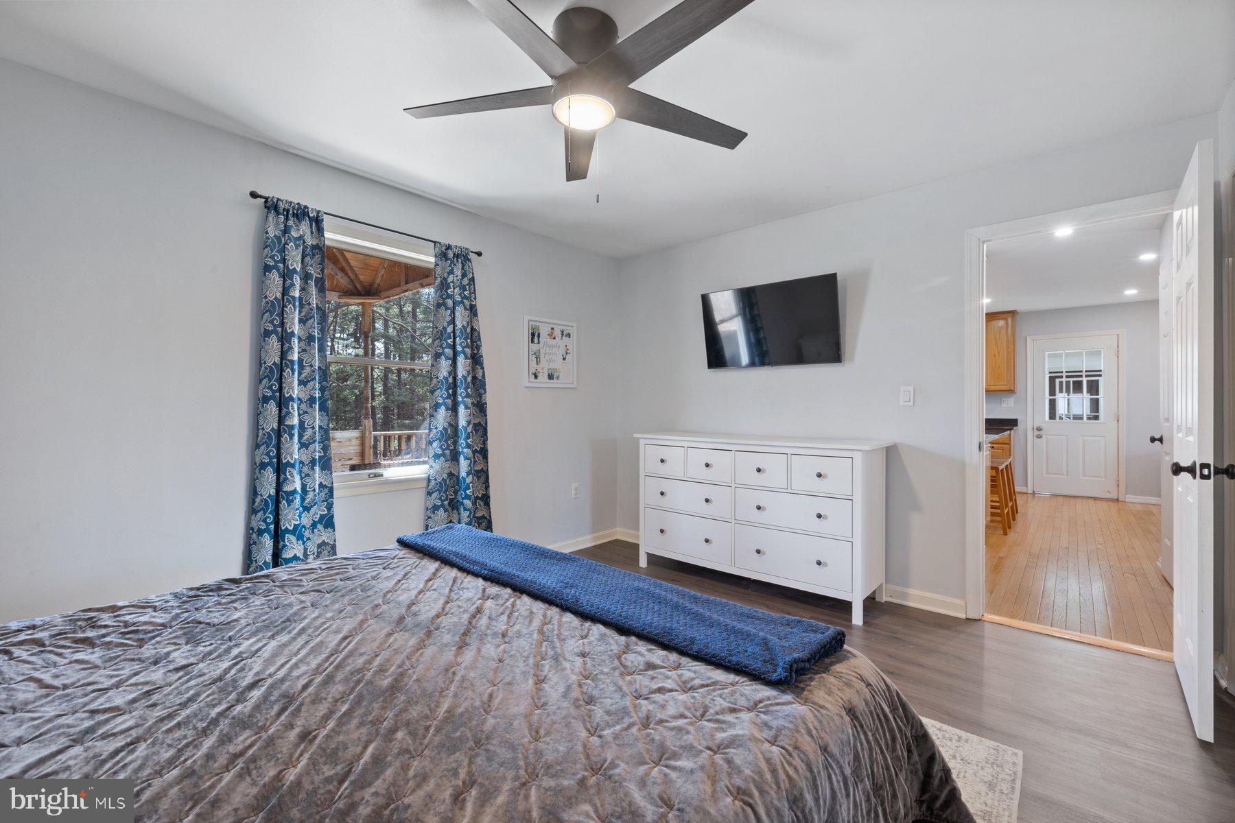 4181 Buffalo Road Mount Airy, MD 21771 - Photo 15 of 38 a bedroom with a bed and a flat tv screen on dresser