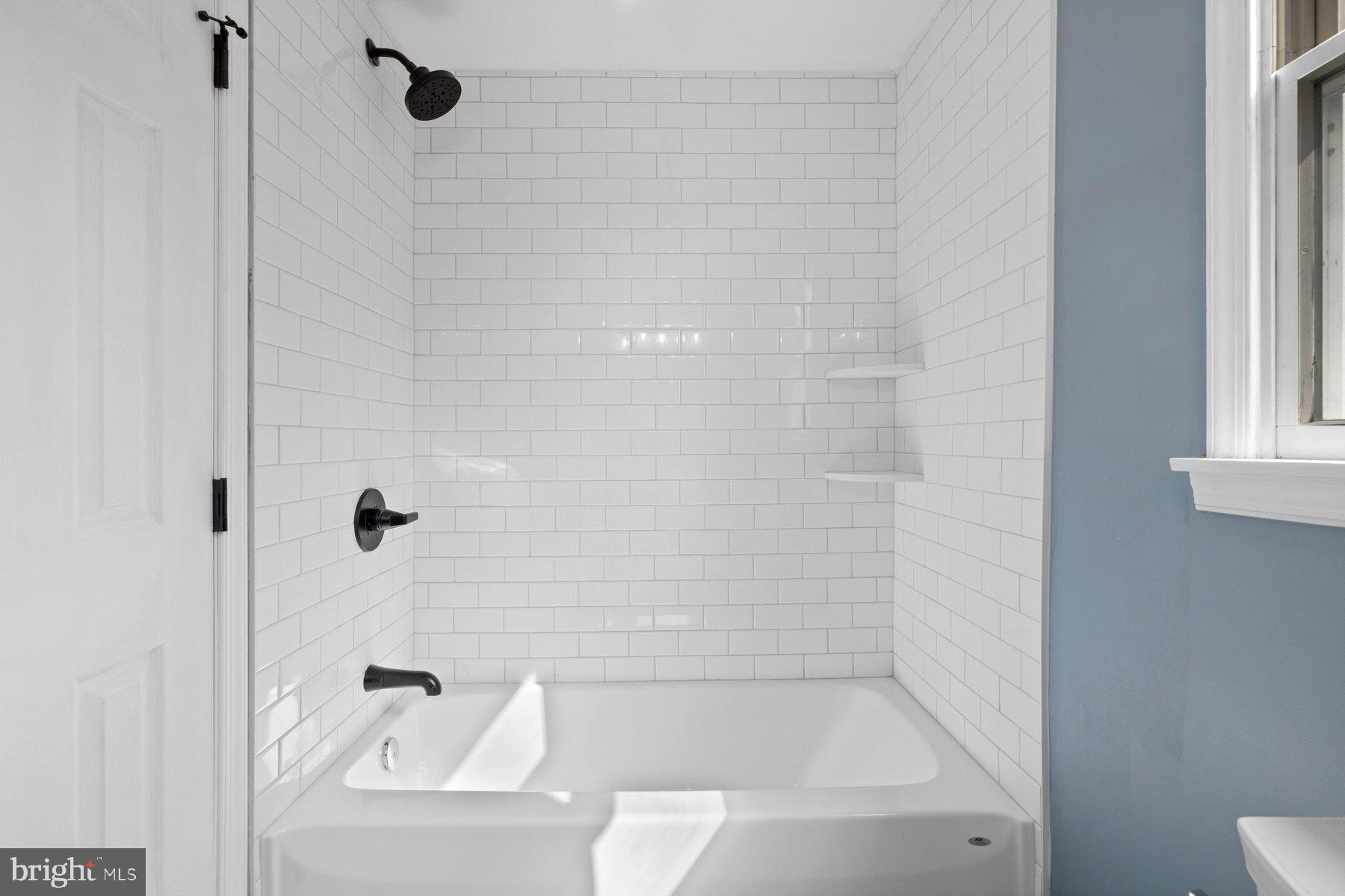 4181 Buffalo Road Mount Airy, MD 21771 - Photo 27 of 38 a bathroom with a bathtub and a shower