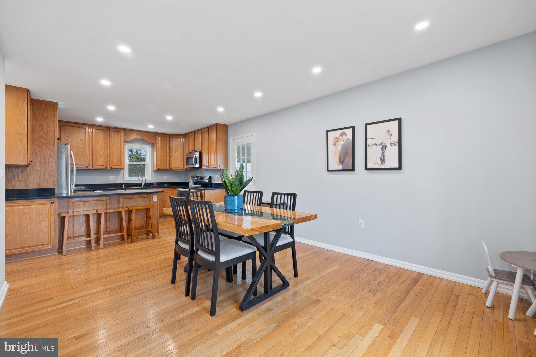 4181 Buffalo Road Mount Airy, MD 21771 - Photo 3 of 38 a kitchen with stainless steel appliances granite countertop a dining table chairs and granite counter tops