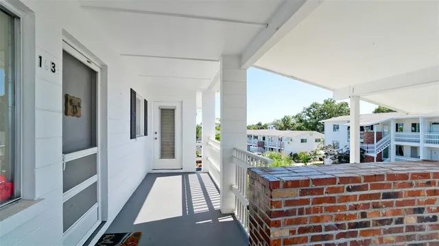 a view of living room with furniture and baby crib