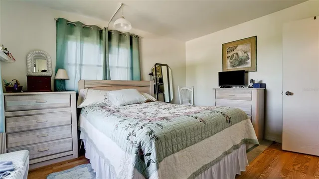 a bedroom with a bed and a view of bedroom