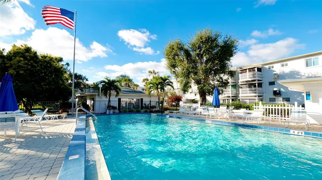 a view of a backyard with sitting area