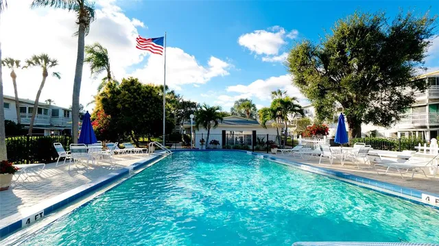 a living room with lots of furniture and a large window
