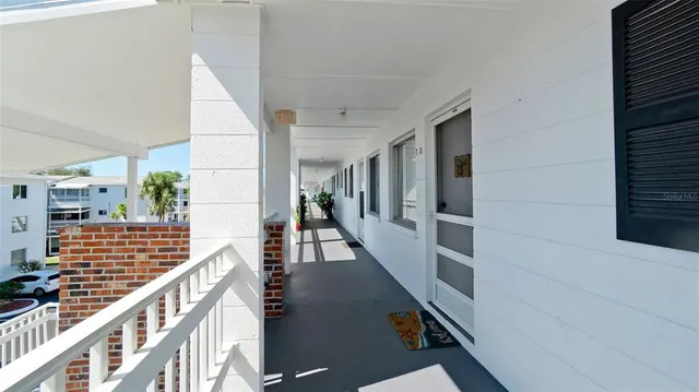 a view of balcony with wooden floor and staircase