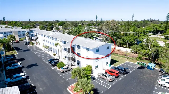 an aerial view of a house with a garden
