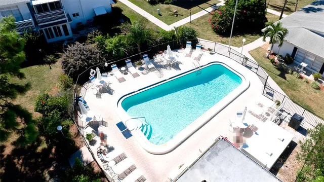an aerial view of a house with yard