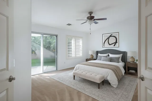 a bedroom with a bed and window