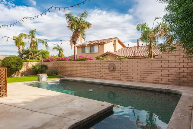 a view of swimming pool with a patio