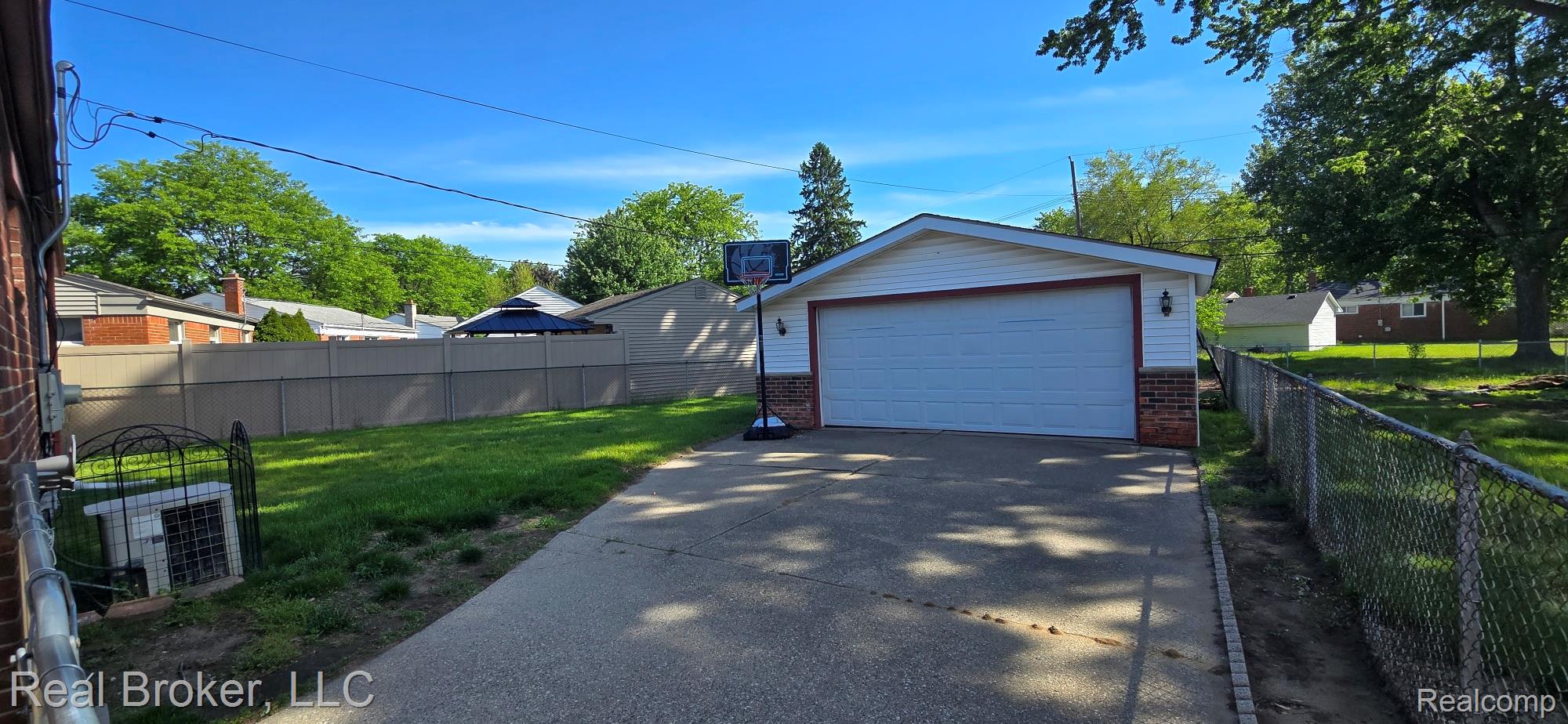 23401 Filmore Street Taylor, MI 48180 - Photo 16 of 16 Detached garage with white siding and brick accents